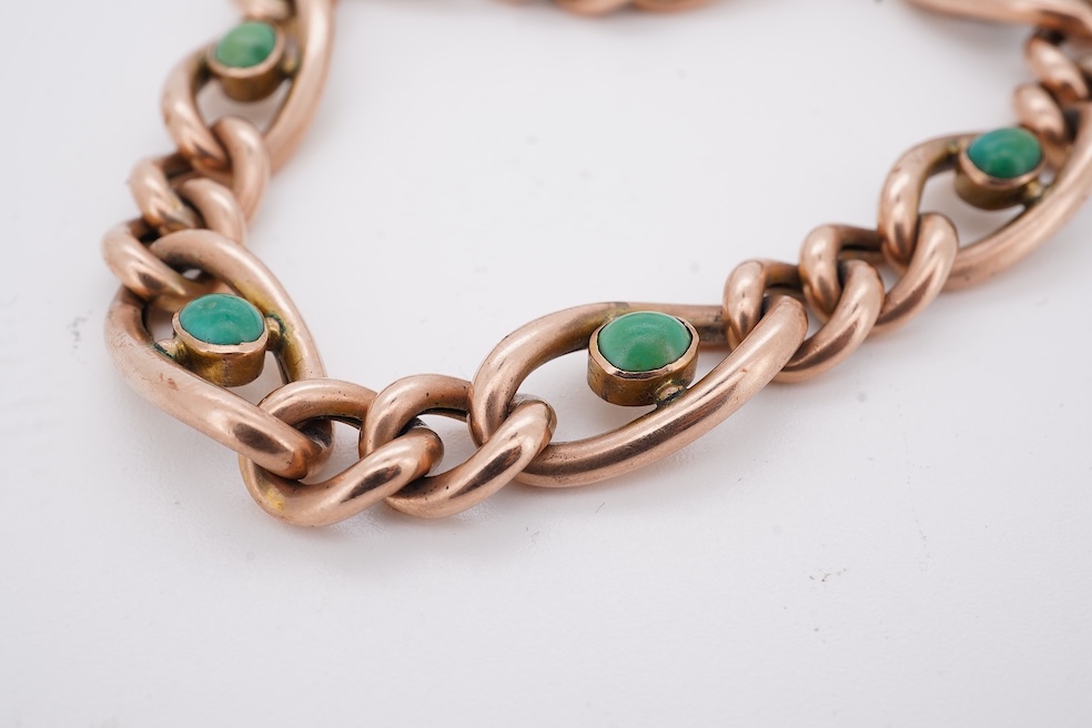 An early 20th century yellow metal (stamped 9c) and seven stone cabochon turquoise set curb link bracelet, 19cm, gross weight 14 grams. Condition - poor to fair